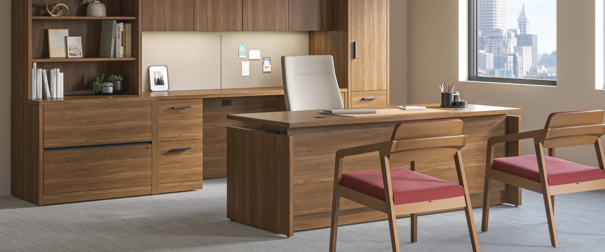 HON 10500 Series wood grain laminate desk, credenza, bookcase and storage tower in a private office with wood frame guest chairs