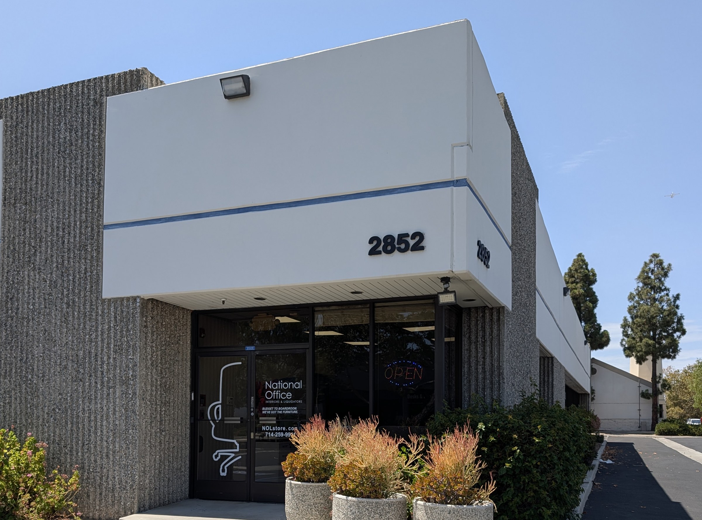 Exterior entrance of the National Office Interiors and Liquidators showroom in Irvine, California